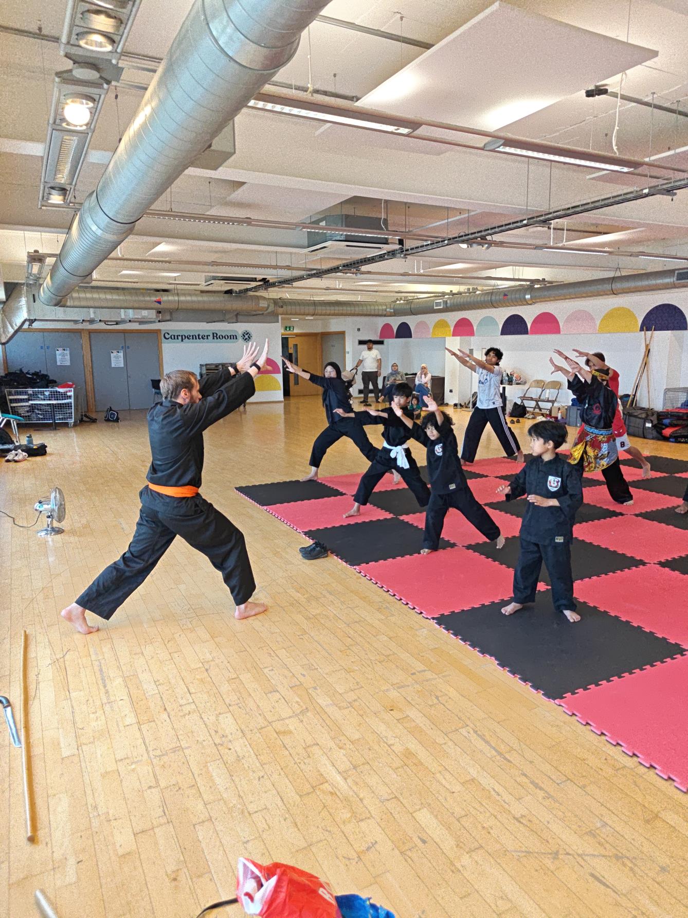 Students learning Seni Jurus Tunggal at the Bristol Silat Seminar