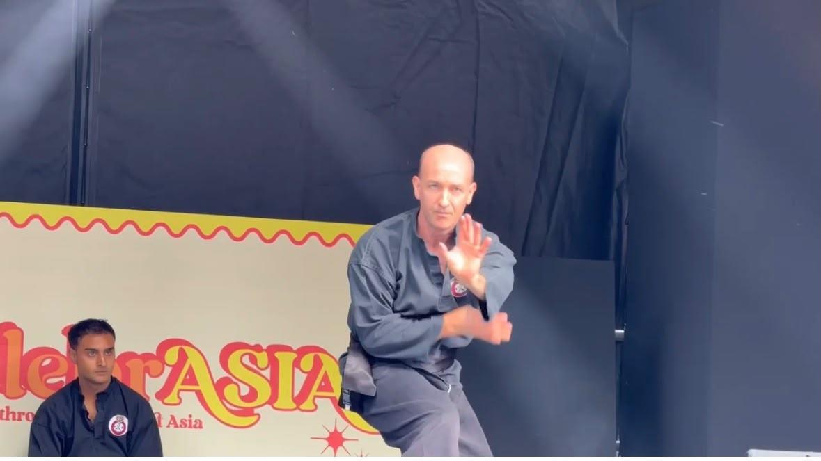 Solo Jurus performance with an open-palm guard on the CelebrAsia stage